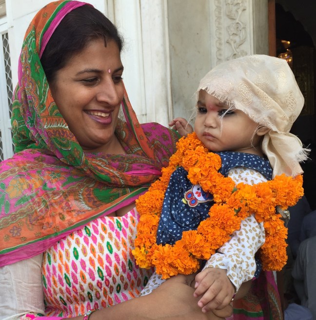 Proud mothers and beautiful babies are universal.