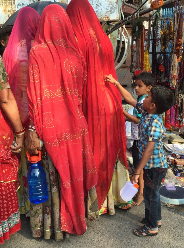 Mother is shopping, child has pressing issue. Some things are universal.