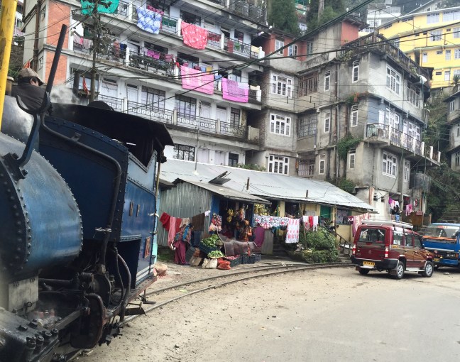 Houses, train, road.