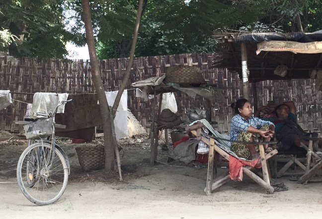 Home, alongside the busy road. 