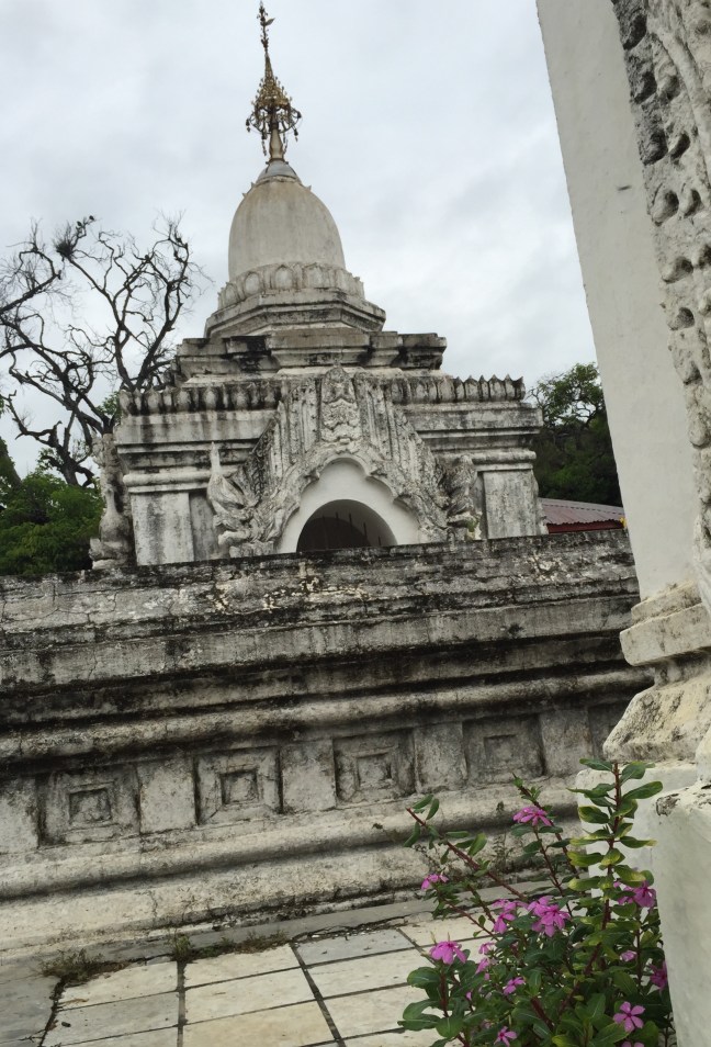 Hundreds of old stupas, each housing one marble 'page' from a sacred book of Buddhist teachings. 