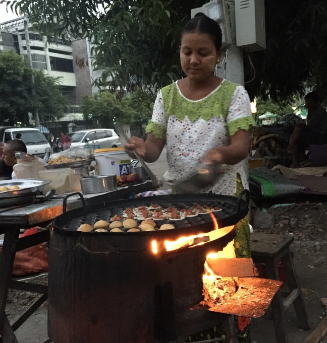 Cooking mini quail-egg omelette-type things. 