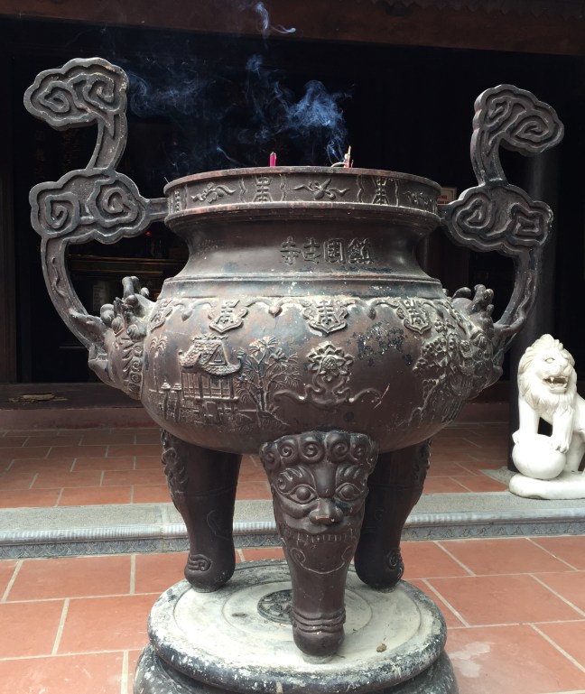 Huge, sand-filled urns that hold incense. You will find one at every place of worship, generally with dozens of sticks of incense burning. The Vietnames believe that smoke is the way words travel from this world to the next, and they send their thoughts and prayers to loved ones this way. I find that so lovely.