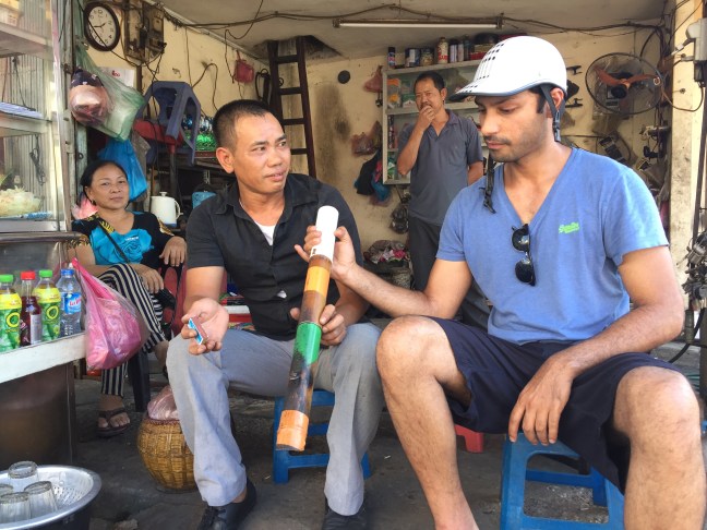 I love everything happening in this picture. We stopped for gas at a station and were curious about the big pipe these men were smoking out of, the likes of which you see people smoking out of everywhere. Smoking in Vietnam is quite prolific and they often use these pipes instead of smoking a cigarette.
