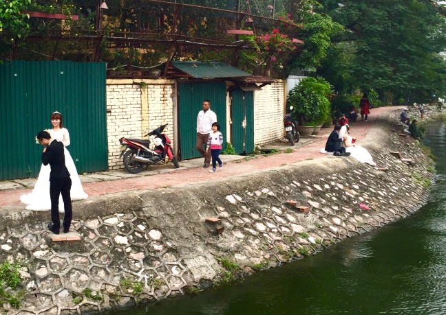 I encountered scenes like this on several occasions... brides and grooms getting their photos on. Darling.
