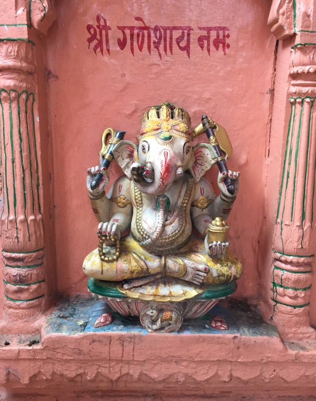 The Hindu god Ganesha. He is the remover of obstacles and bringer of luck and as such, adorns the entryway to every home, temple and business.