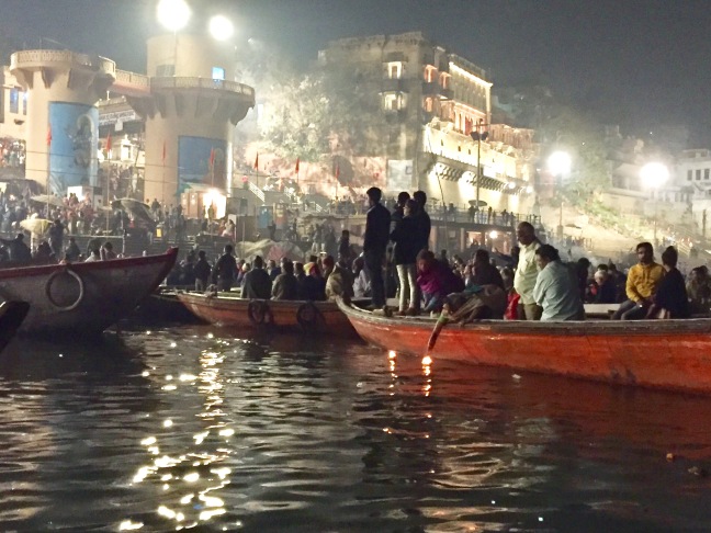 Boats parked along the ghats, enjoying the show