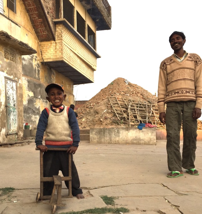 A little boy and his father who live in a meager space along with several other family members just outside our hotel. Such simplicity and such happiness.