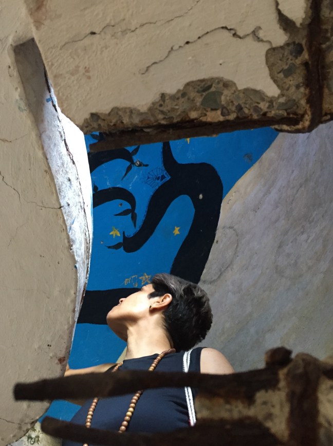 Annabell inside one of the individual meditation huts. 
