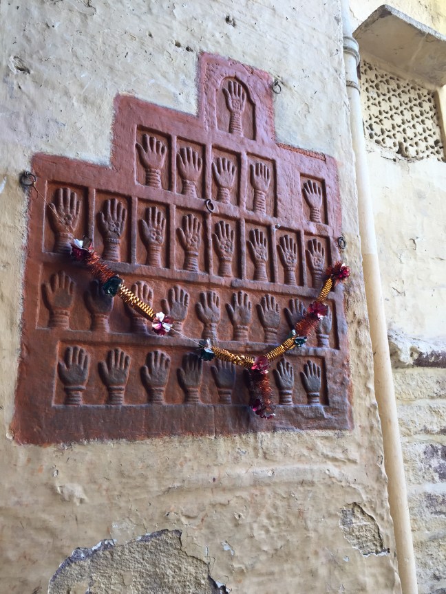 The infamous Handprints of Sati, outside Mehrangarh Fort. Sati was the ancient custom where widowed wives (and concubines) cast themselves upon their deceased husbands funeral pyre out of love and devotion.